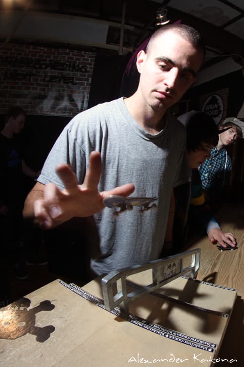 A fingerboarder mid-trick at Fast Fingers 13 (2010).