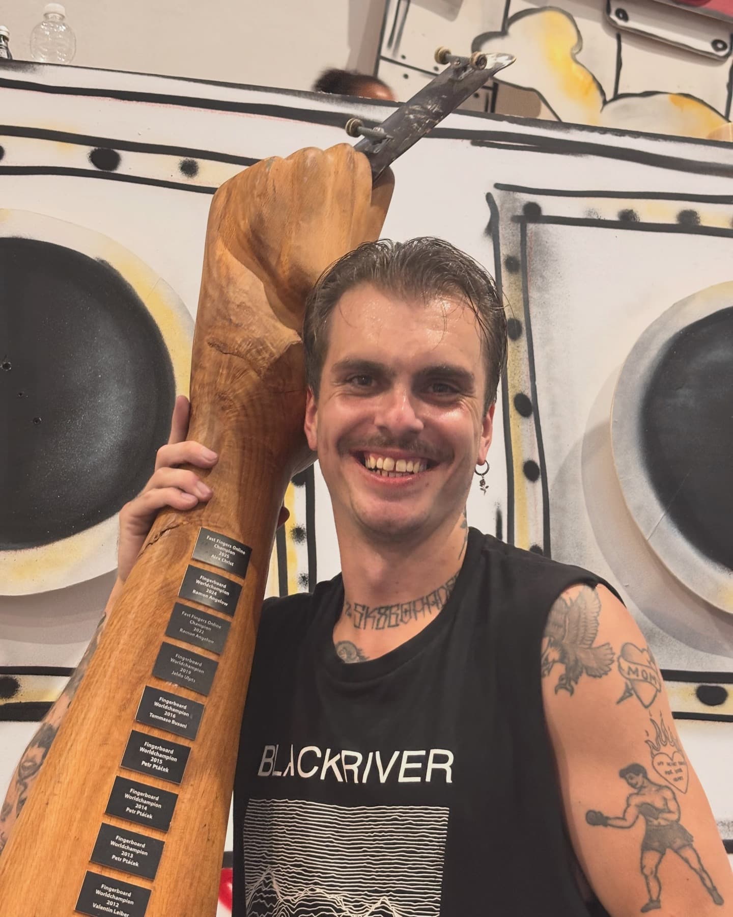 Alex Christ holding the Fast Fingers trophy after FF22 (2026).