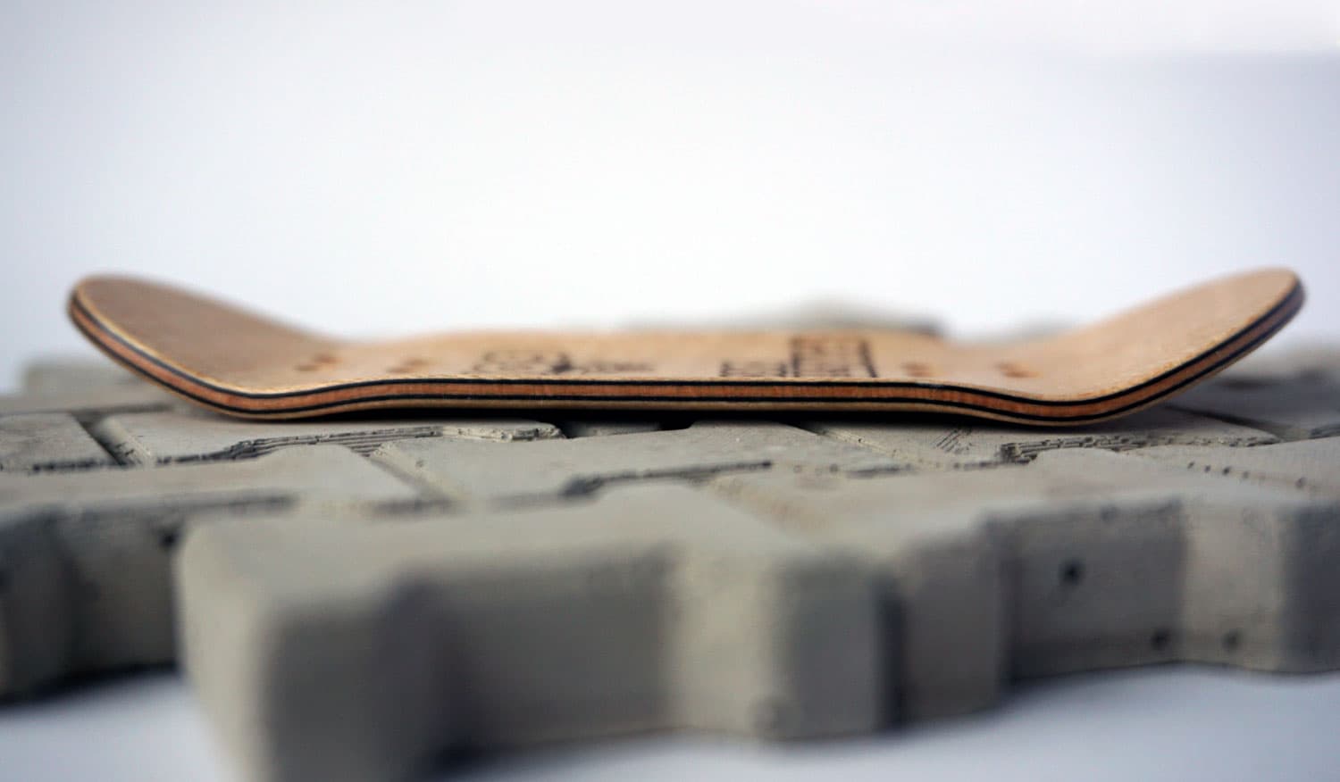 Head-on view of a Prete 6011 fingerboard deck showing the concave across its width.